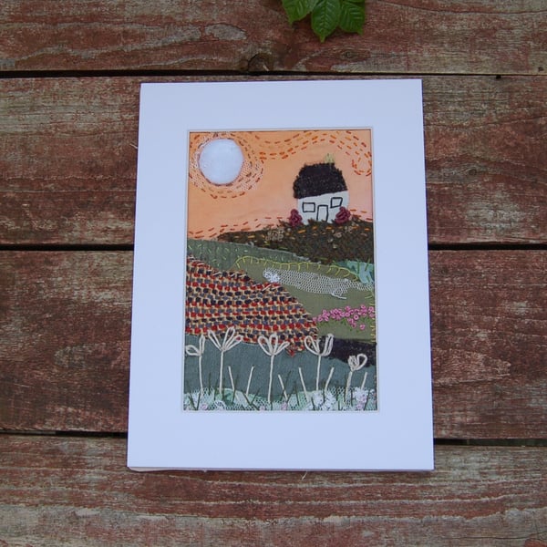 Early morning sunrise.  Upcycled fabric hand stitched picture 