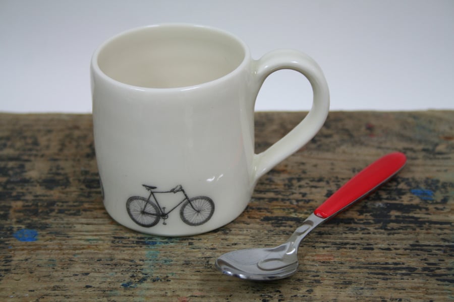 Small porcelain mug with bicycles