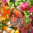 Sunset on the coast pyrography with colour hanging wood slice