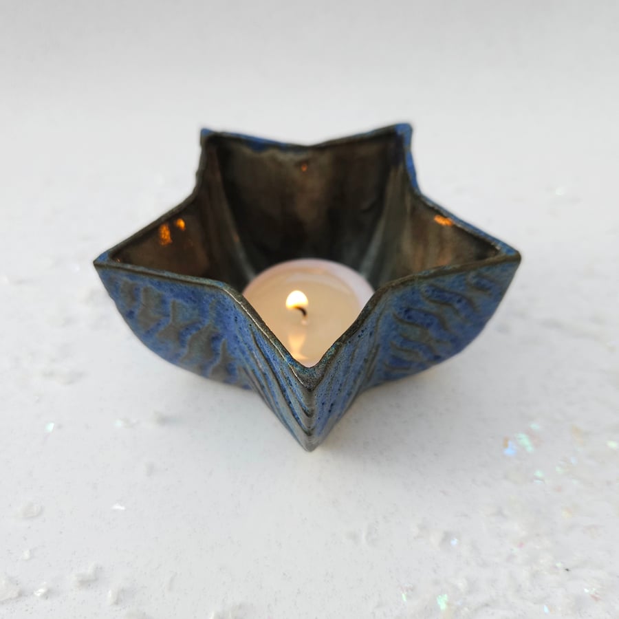 Candle Holder in black porcelain, with carved texture - star