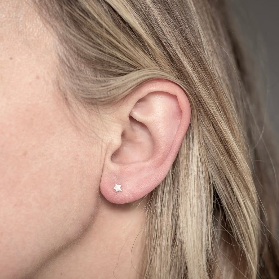 Teeny silver star studs