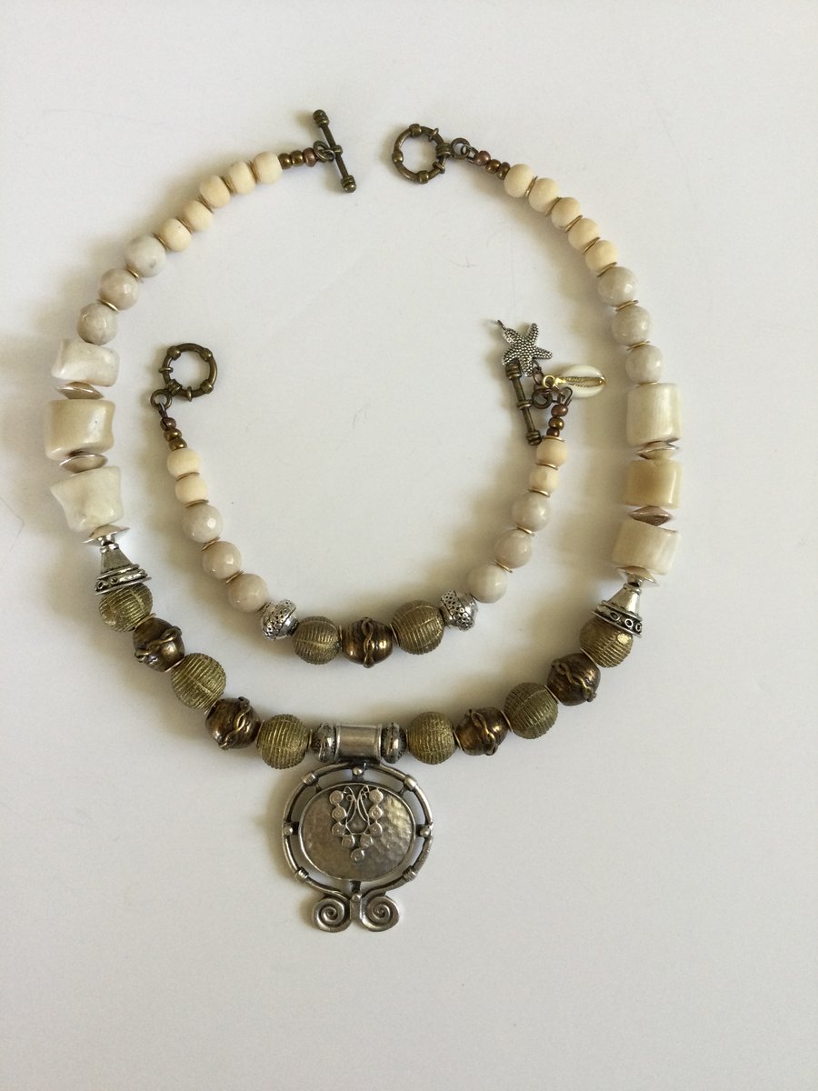 Chunky coral and multimedia silver pendant necklace with matching bracelet 