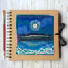 Square embroidered seascape journal or sketchbook. 