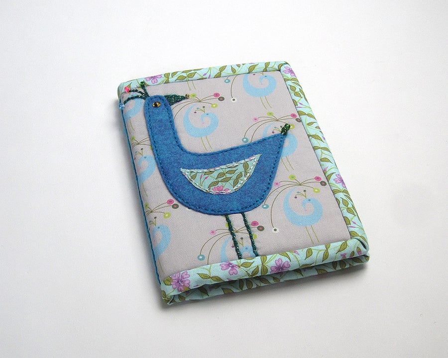 A6 notebook with peacock print and bird appliqué