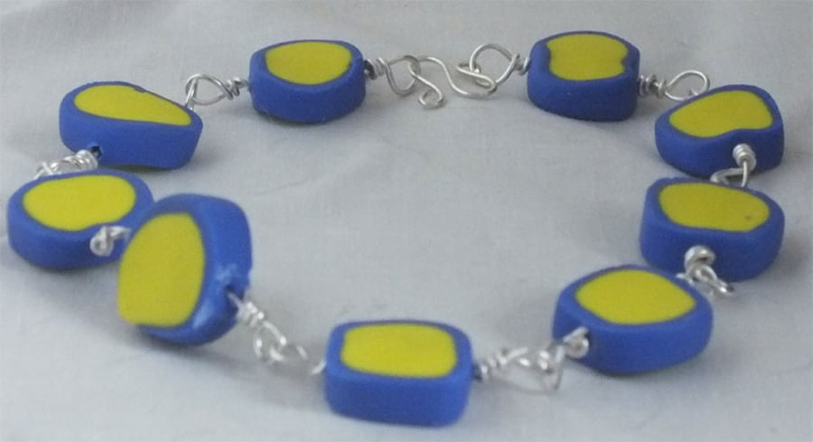 Blue and yellow Bullseye can polymer clay bracelet