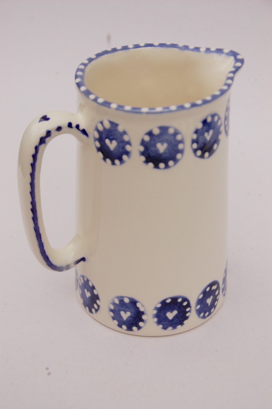 blue and white one pint jug, hearts and dots