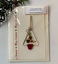 Greetings card with detachable decoration - Image 1