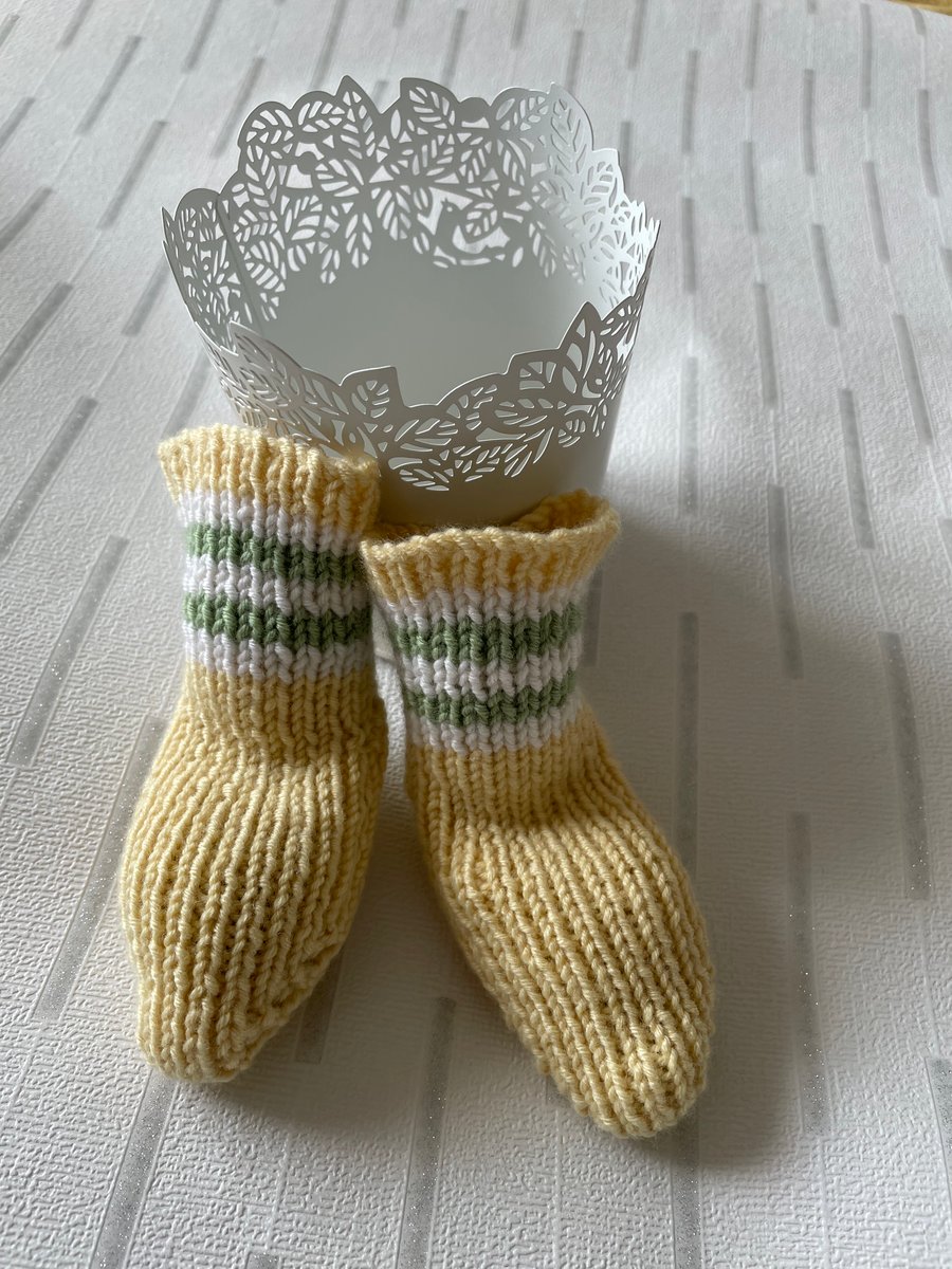 Yellow baby socks with striped tops