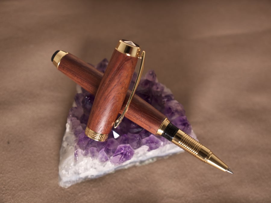 Padauk wood rollerball pen hand crafted by the sea on Orkney, R7,2