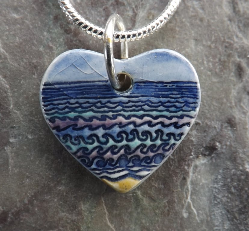 Ceramic heart shaped Waves pendant in blue, purple and turquoise 