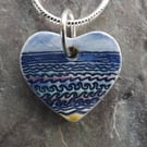 Ceramic heart shaped Waves pendant in blue, purple and turquoise 