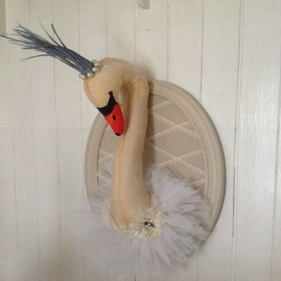Mounted textile swan in a tutu