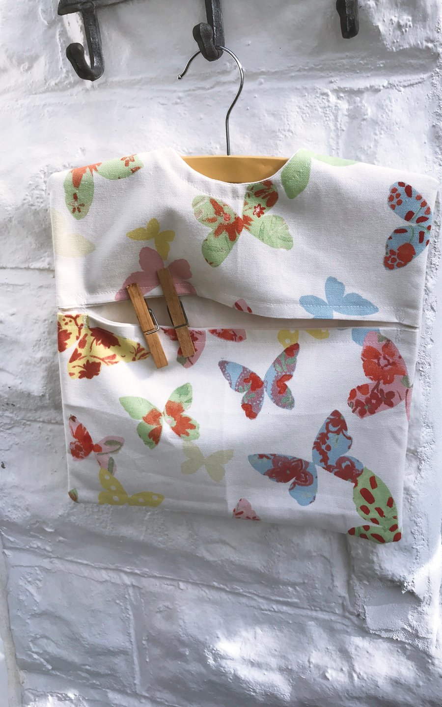 Butterflies Lined Peg Bag includes a wood hanger