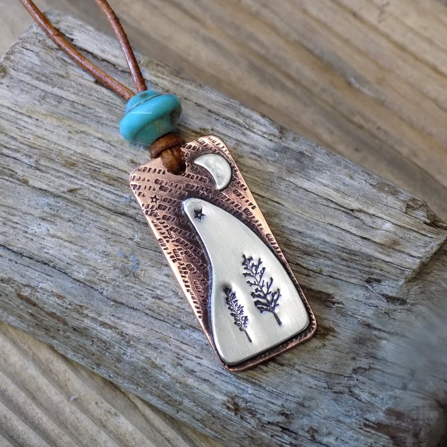 Copper and silver ' night sky ' scene pendant
