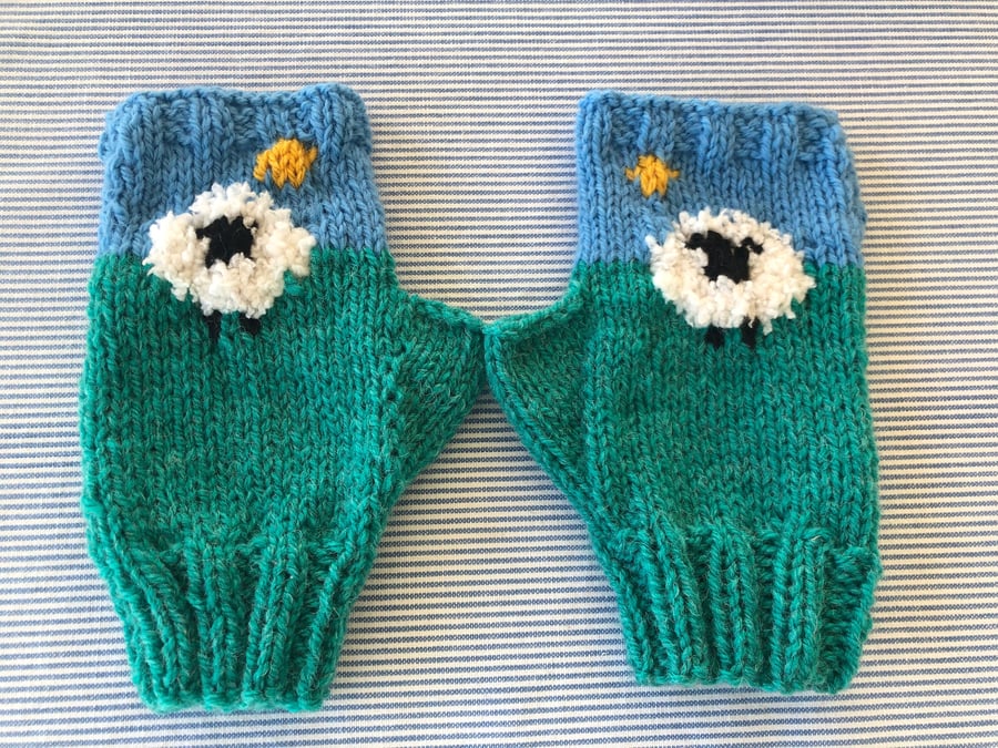 Hand knitted fingerless mittens with thumbs , sheep . Money to cat rescue .