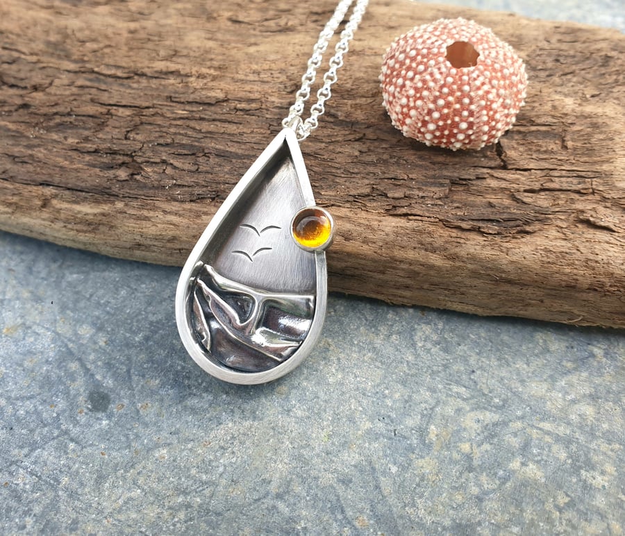 Sterling silver teardrop beach scene pendant with amber 