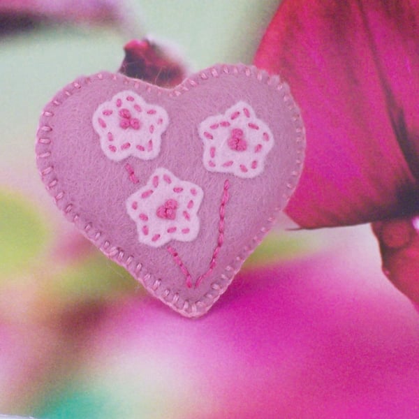 Pink hand stitched felt heart shaped brooch with embroidery