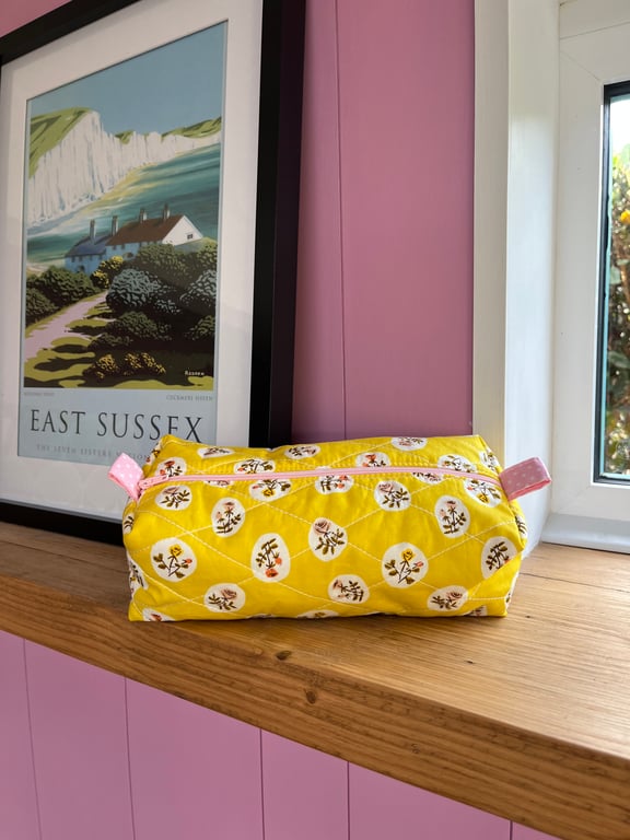 Handmade quilted floral make up bag with polka dot lining 