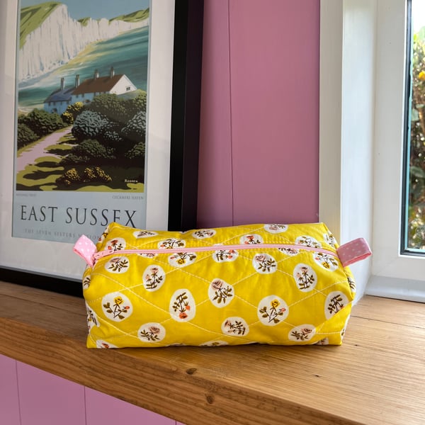 Handmade quilted floral make up bag with polka dot lining 