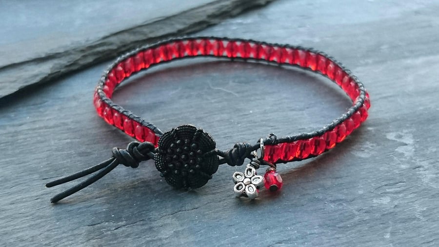 Black leather and red beaded bracelet