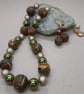 Polymer clay necklace in a brown swirl design with a hint of sparkle - Image 4