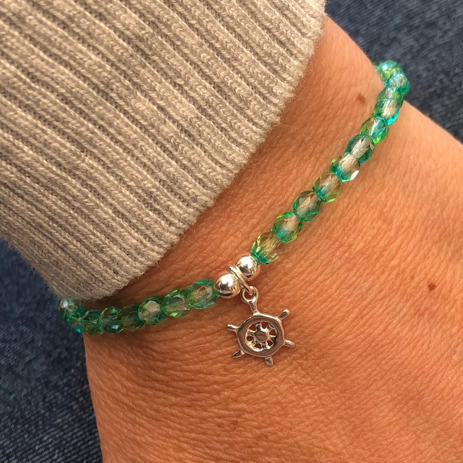 Faceted Czech glass beaded bracelet with ship wheel charm