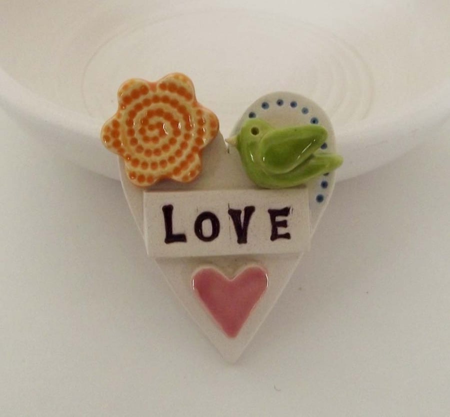 Tiny, teeny bird Loveheart ceramic brooch
