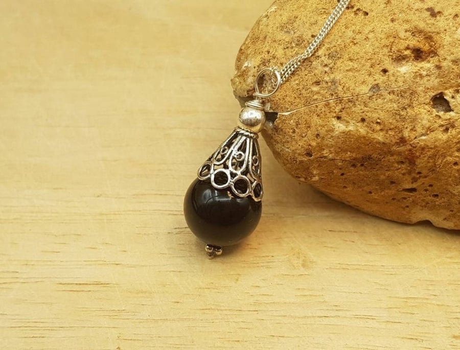 Small Black Onyx pendant. December birthstone. 7th anniversary gemstone
