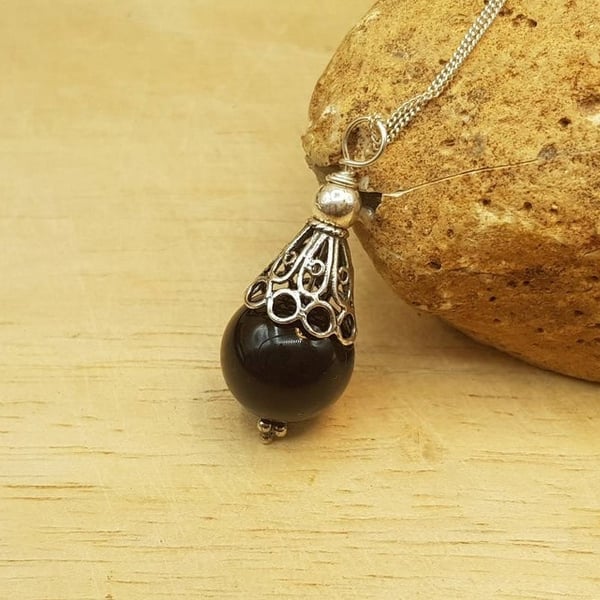 Small Black Onyx pendant. December birthstone. 7th anniversary gemstone