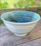 Hand-thrown stoneware bowl in teal glaze