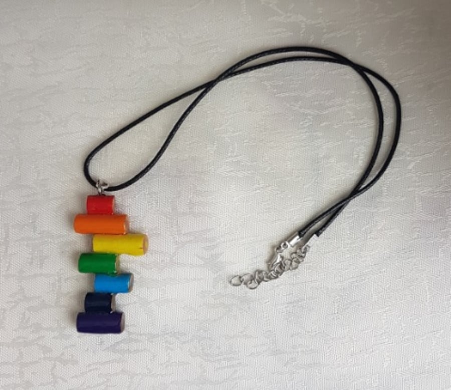 Gorgeous Rainbow wooden pendant on cord - Abstract design
