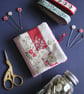 Patchwork stripe needle case made from Tilda fabric in shades of red and natural