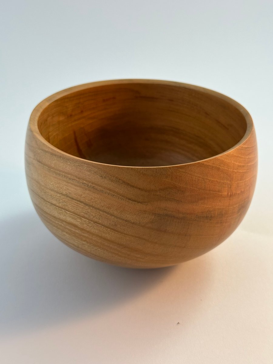 A medium sized bowl in Cherry wood.