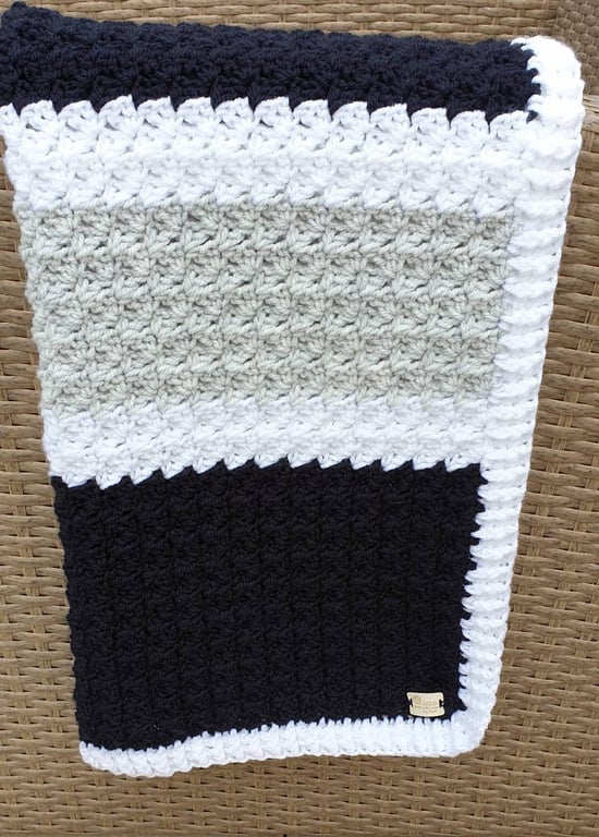 Oxford Blue, pale grey and white striped crocheted baby blanket