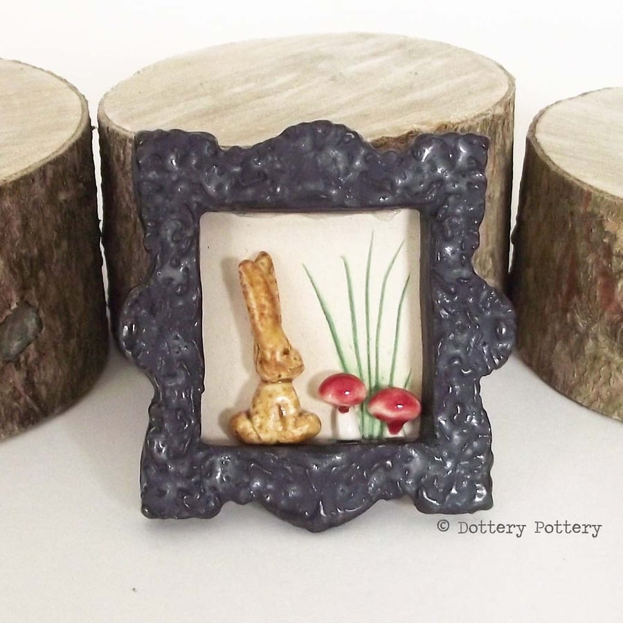 Little ceramic bunny rabbit brooch with toadstools Pottery jewellery. 