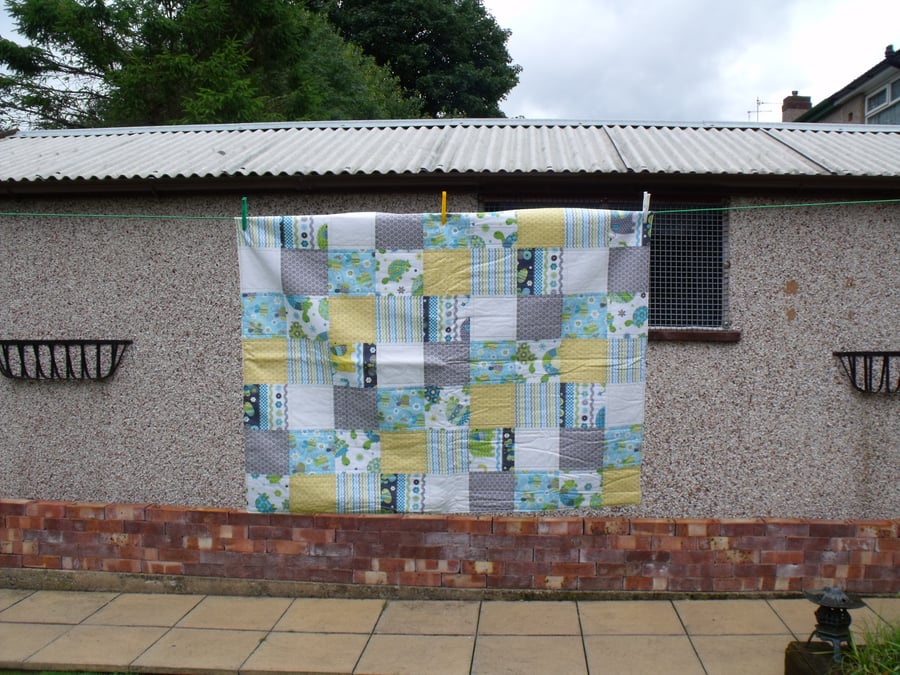 unisex baby blanket with animals, muted coloured quilted duvet for nursery