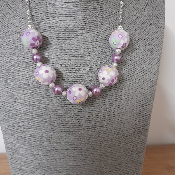 LAVENDER, PURPLE AND SILVER FLORAL FABRIC BEADED NECKLACE WITH FREE EARRINGS.