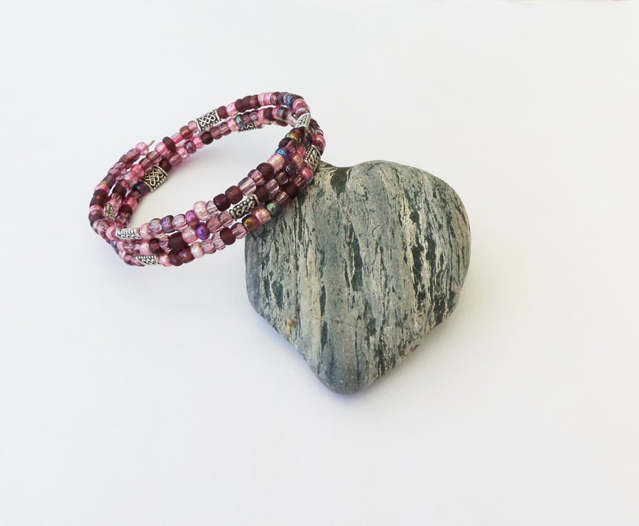 Pink seed bead mix, Tibetan silver Celtic knot bead memory wire wrap bracelet