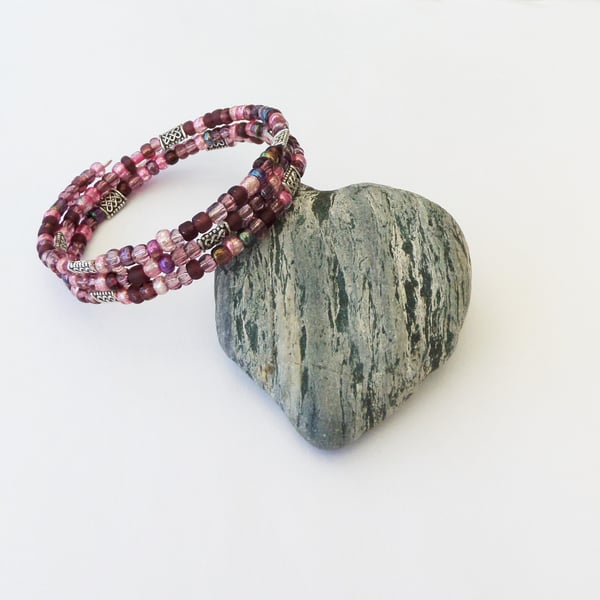 Pink seed bead mix, Tibetan silver Celtic knot bead memory wire wrap bracelet