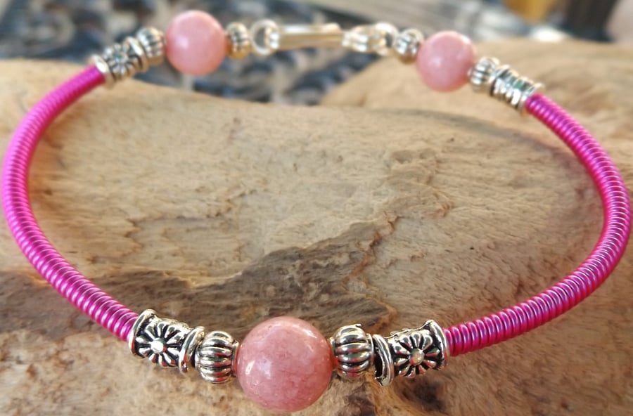 7.5" silver plated wire bracelet with pink gizmo wire cover and pink jade