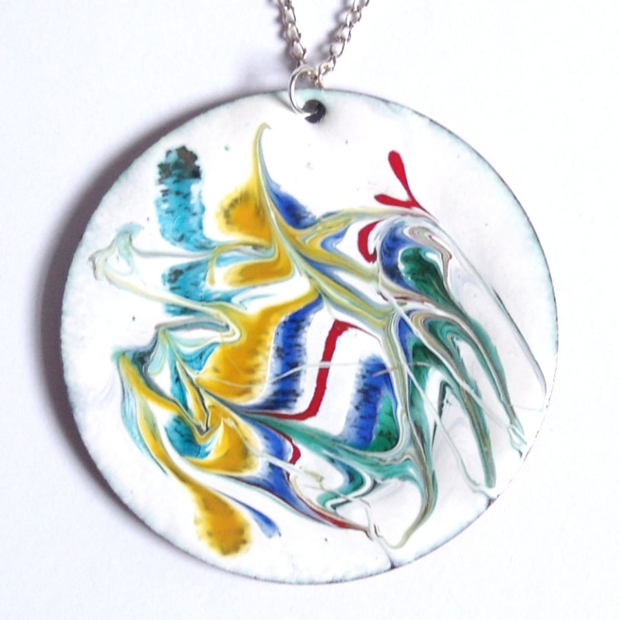 large round enamelled pendant - scrolled green, blue, red, gold on white