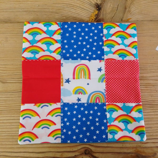 Cushion cover made in a colourful red and blue theme with envelope closure.