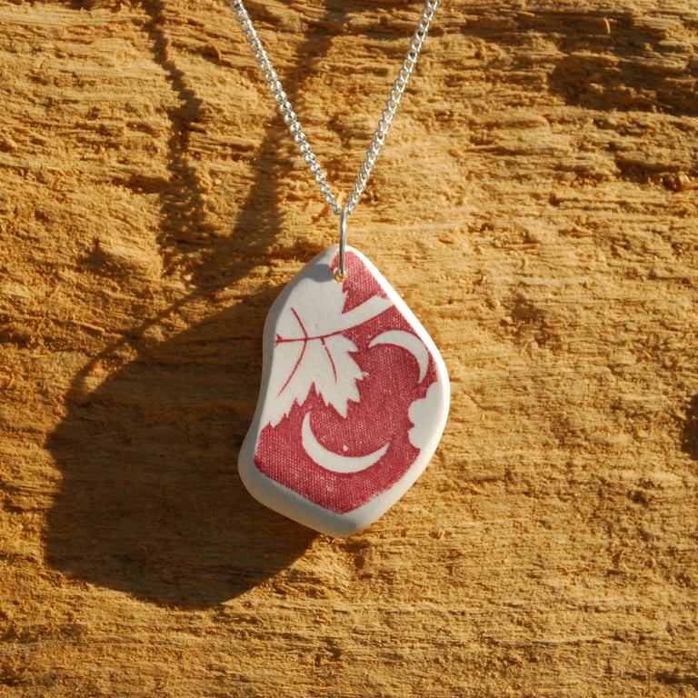 Sea pottery pendant with moons and leaf