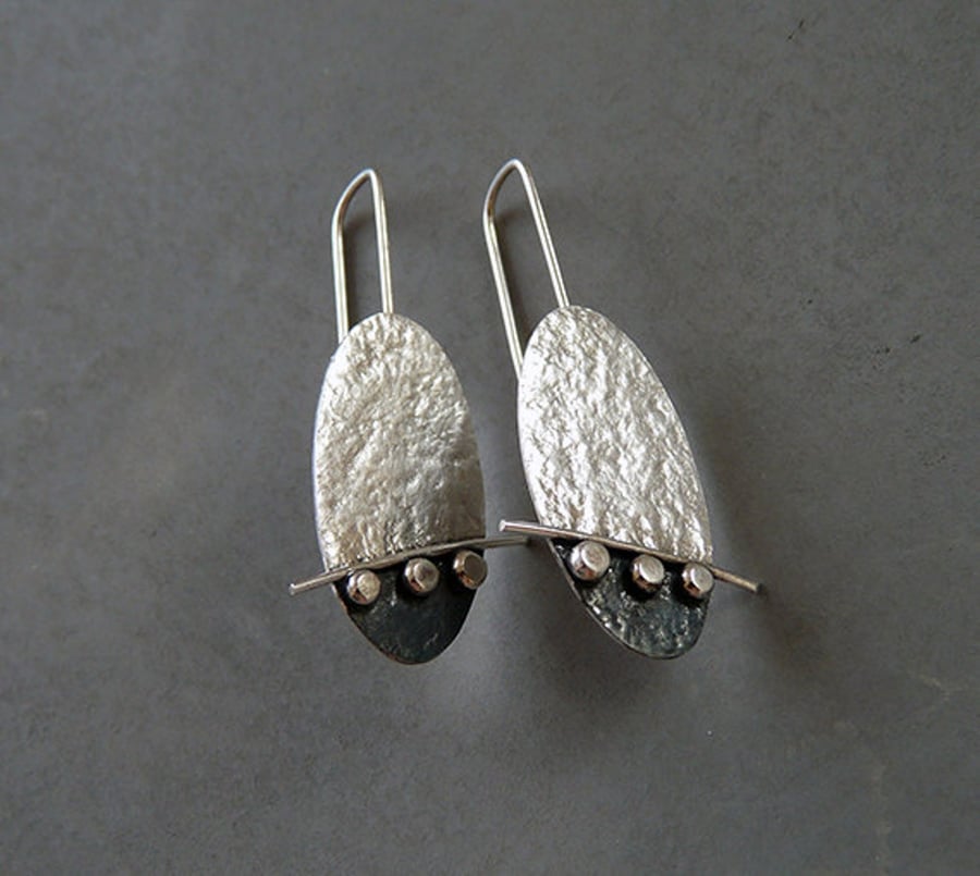 Handmade sterling silver oval oxidised earrings.