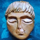 Serene Face Wall Art Carving 