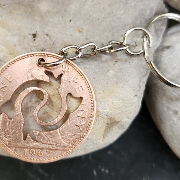 Pisces symbol cut from penny coin as bag charm or keyring