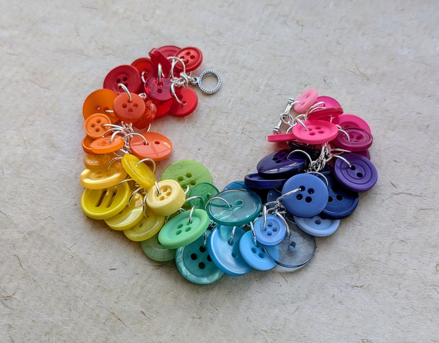 Rainbow button bracelet on silver plated chain with toggle clasp fastening
