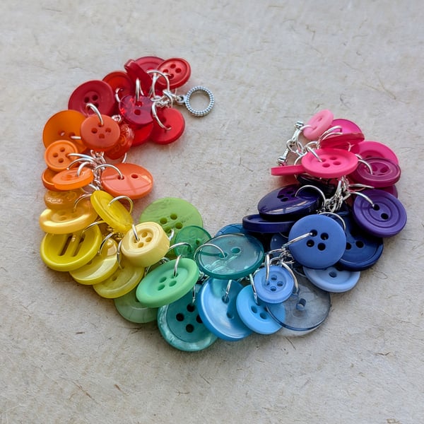 Rainbow button bracelet on silver plated chain with toggle clasp fastening