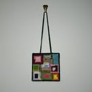 Small wall decoration with funky square pattern and adjustable hang length