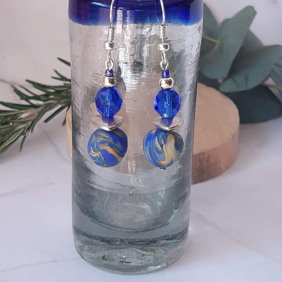 Blue and gold polymer clay dangly earrings